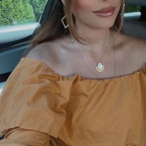 Off the shoulder orange ruffle top